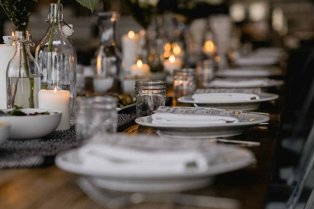 Candlelit table set for an intimate private dinner at home